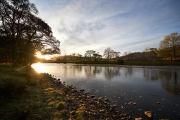 Wall Mural - sunrise over kinlochewe river near beinn eighe, torridon, on a cold winters morning in the scottish 