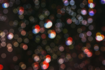 colorful glitter vintage lights background. defocused