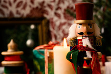 Nutcracker And Christmas Decoration In Background