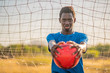 © Javier De La Torre/ADDICTIVE STOCK - African American football player with ball