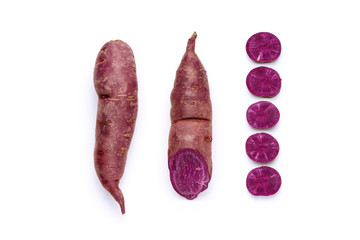 Wall Mural - Sweet Potato Purple Raw Vegetable Antioxidant Nutrient Cut Out. Bio Ipomoea Batatas Sliced Pieces with Violet Color Soft Flesh Isolated on White Background. Natural Ground Food Vitamin Product Yam