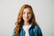© alexshutter95 - Red-haired pretty teenager girl smiling at the camera. Isolate on white background. Blue-eyed child with a benevolent emotion
