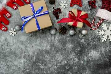 Wall Mural - Table top view of Merry Christmas decorations & Happy new year ornaments concept.Flat lay essential difference objects gift box & fir tree on modern cement background at home studio office desk.