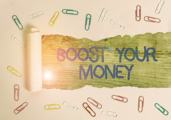 Wall Mural - Handwriting text Boost Your Money. Conceptual photo increase your bank saving using effective methods Paper clip and torn cardboard placed above a wooden classic table backdrop