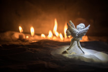 Little White Guardian Angel In Snow. Festive Background. Christmas And New Year Concept. Selective Focus