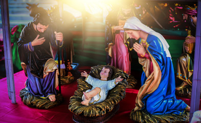 The traditional Christmas scene and the sacred light shining down for use in illustrations of the baby nativity scene, including Jesus, Mary and Joseph.