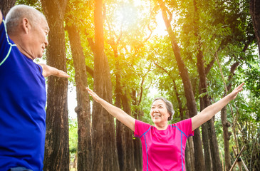 Wall Mural - happy asian Senior  couple exercising outdoors