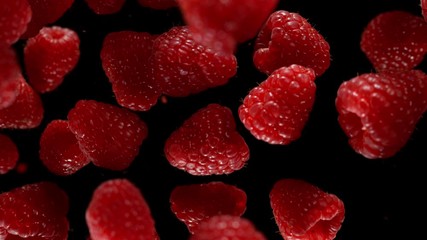 Poster - Exploding raspberries with water on a black background. Filmed on high speed cinema camera, 1000fps.