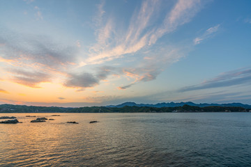 beautiful twilight sunset with blue sky high peak mountains mist fog green forest  park ocean sea idea for backpacker guiding backpacking camping campfire relax hiking  long weekend at Wakayama Japan