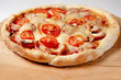 © Maxim - little homemade pizza lies on a wooden board