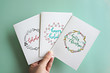 © PohKim - Hand holding hand drawn Christmas greeting card