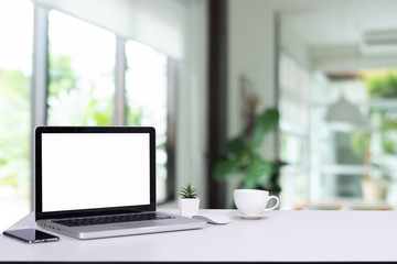 computer notebook and mouse with a coffee shop behind the