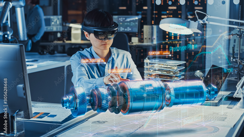 Industrial Factory Chief Engineer Wearing AR Headset Designs a Prototype of an Electric Motor on the Holographic Projection Blueprint. Futuristic Virtual Design of Mixed Technology Application. - obrazy, fototapety, plakaty 