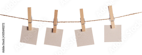 Fotografía Set of blank notes held on string isolated