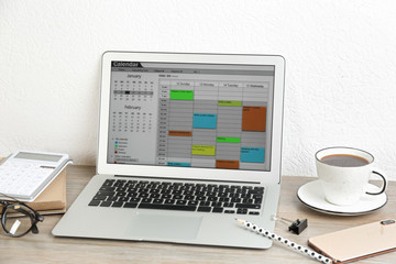 Poster - Modern laptop with calendar app in office