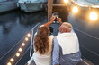 © Alessandro Biascioli - Senior couple toasting champagne on sailboat vacation - Happy mature people having fun celebrating wedding anniversary on boat trip - Love relationship and travel lifestyle concept