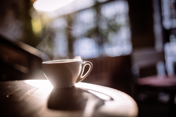 Steamy coffee cup in the sunlight