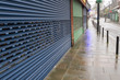 High Street Shops closing down with shutters closed, decline in shopping in Wales, United Kingdom