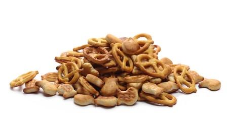 Salty cracker and pretzel snacks, party mix isolated on white background