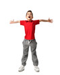 © Dmitry Lobanov - boy kid in red t-shirt and grey pants spread hands up happy smiling screaming laughing isolated on white