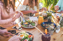 Hands View Of Young People Eating Brunch And Drinking Smoothies Bowl With Ecological Straws In Trendy Bar Restaurant - Healthy Lifestyle, Food Trends Concept - Focus On Left Woman Hand, Dish
