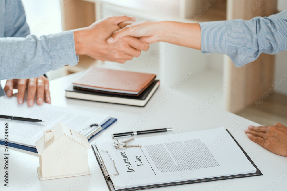 client customer handshake together for successful deal to buy insurance ...