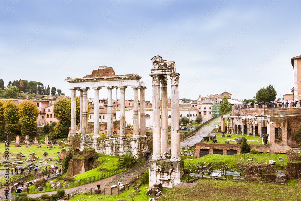 Roman Forum, Forum Romanum in Latin, a rectangular square surrounded by the ruins of several important ancient government buildings at the center of Rome in Italy. Stock PH๏τo | Adobe Stock
