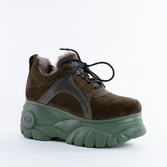 very cool stylish green warm female nubuck sneakers with high soles. On white background. Choose other angles of this boot and new models in my profile