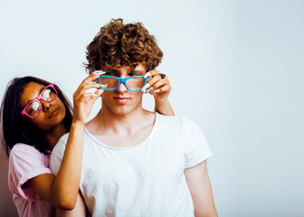 best friends teenage girl and boy together having fun, posing emotional on white background, couple happy smiling, lifestyle people concept, blond and brunette multi nations close up