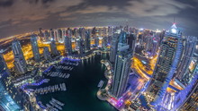 Dubai Marina Skyscrapers And Jumeirah Lake Towers View From The Top Aerial Night Timelapse In The United Arab Emirates.