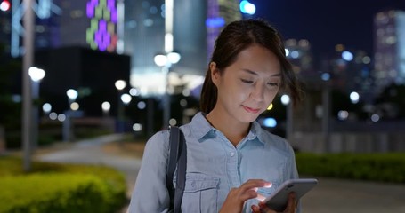 Poster - Woman use of mobile phone in city at night