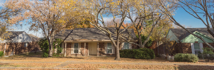 Wall Mural - Panoramic single story bungalow houses in suburbs of Dallas with bright fall foliage colors