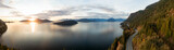 Fototapeta  - Sea to Sky Hwy in Howe Sound near Horseshoe Bay, West Vancouver, British Columbia, Canada. Aerial panoramic view during a colorful sunset in Fall Season.