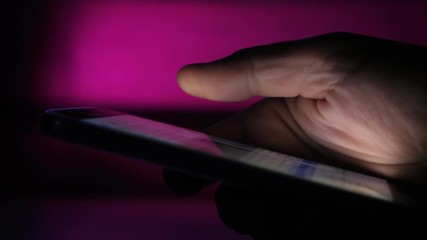 Wall Mural - Male hand touching and scrolling a phone screen with messages and pictures