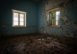 Interior of a dirty abandoned  room with dry cracked mud