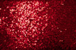 Red sequinned background . Holidays backgrounds and textures . Christmas and St. Valentine’s Day background.