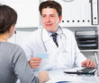 © JackF - Doctor speaking with client in the medical center