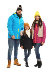 Poster - Happy family in warm clothes on white background. Winter vacation