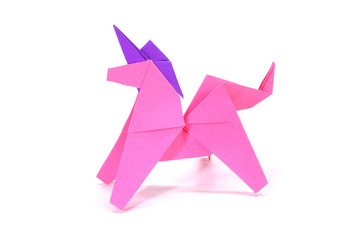 Unicorn. Pink unicorn origami paper art isolated on white background. Ideas for DIY hobby (Do It Yourself) for Children.                                