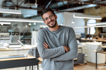 Buckle up, you are going to be a millionaire. Young businessman posing in office