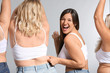 Group of body positive women on grey background