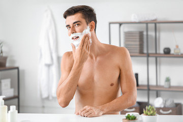 Poster - Handsome young man shaving at home