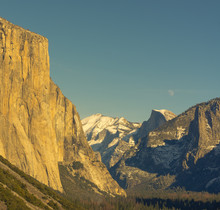 Tunnel View In The Winter With El Capitan In The Sun And The Moon Rising Over Half Dome.