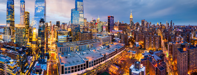 Fototapete - Aerial panorama of New York City skyscrapers at dusk as seen from above the 10th avenue and 29th street, close to Hudson Yards and Chelsea neighborhood
