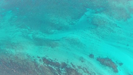Wall Mural - background of turquoise tropical sea water aerial pattern