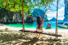 Happy Traveler Woman In Bikini Joy Relaxing On Swing In Beautiful Nature Scenic Landscape Island, Famous Landmark Travel Thailand Summer Fun Beach, Tourism Destination Place Asia Holiday Vacation Trip