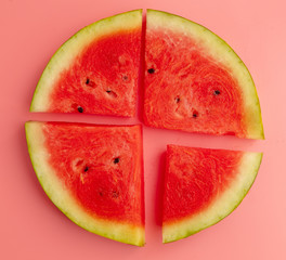 Canvas Print - Ripe red watermelon isolated on a pink background.