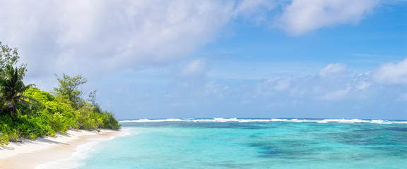 Wall Mural - Panoramic view of tropical beach and clean azure water