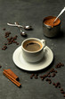 glass of americano coffee in grey background decorated with coffee beans