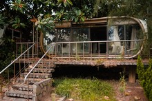 An Abandoned Ancient Building With Windows And Concrete Stairs In Wanli UFO Village, Taiwan